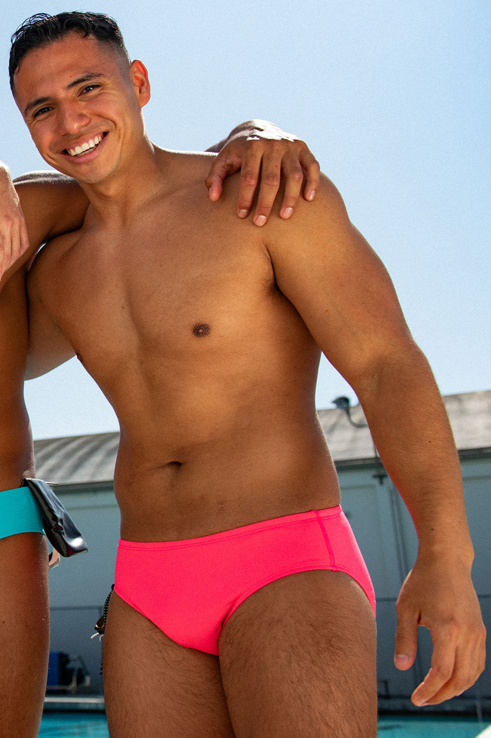 Lifestyle image of BROLYN Hot Pink, men's swim brief by JOLYN Australia