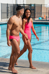 Lifestyle image of BROLYN Hot Pink, men's swim brief by JOLYN Australia